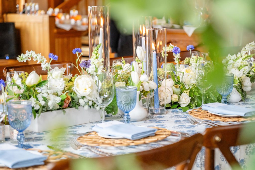 A wedding table arrangement featuring pops of blue.